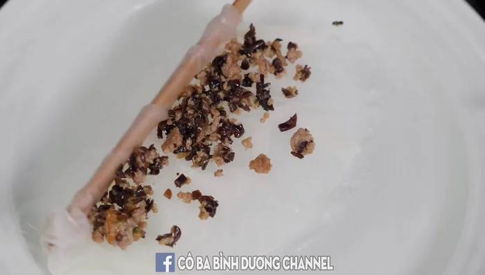 Carefully remove the cooked rice roll using a flat chopstick or a knife. Add the filling, roll up, and slice.