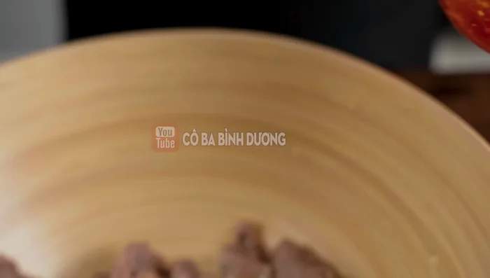 Add 2-3 tablespoons of fish sauce to the blanched beef and mix well.