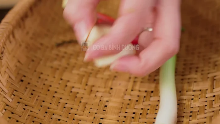 Finely chop chilies, chives, and garlic.