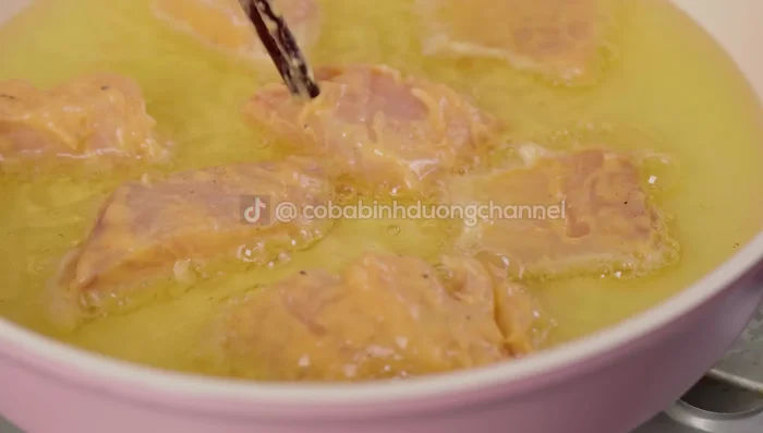 Heat oil in a frying pan and fry the fish until golden brown, turning to ensure even cooking.