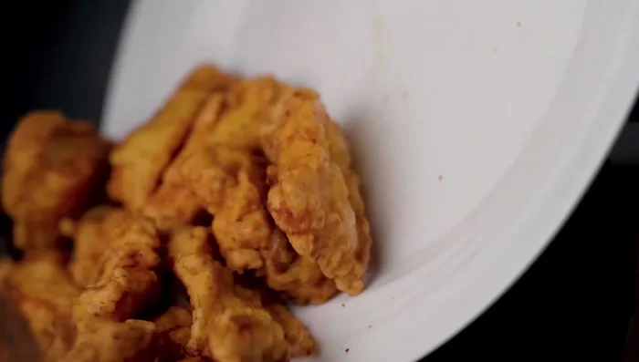 Add the fried fish and stir gently to coat with the sauce. Do not stir too hard.