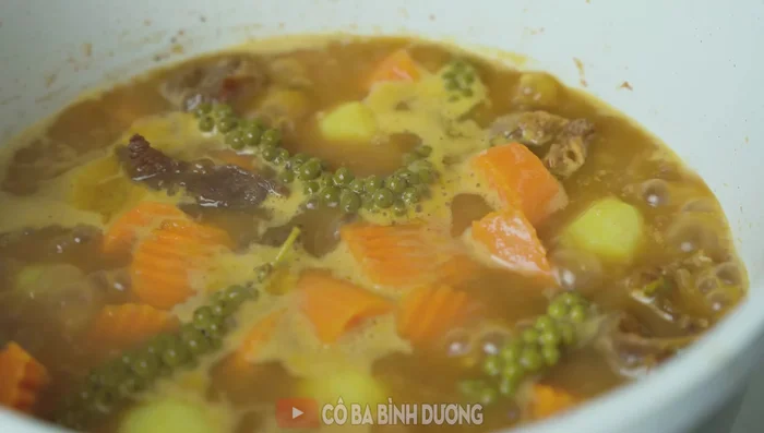 Taste and adjust seasoning. Add tapioca starch (optional) for thicker consistency. Add green pepper for garnish.