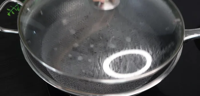 Wash pork and skin thoroughly with lemon, salt, vinegar, or wine. Blanch pork briefly in boiling water with salt, shallots, and ginger (until outer layer firms).