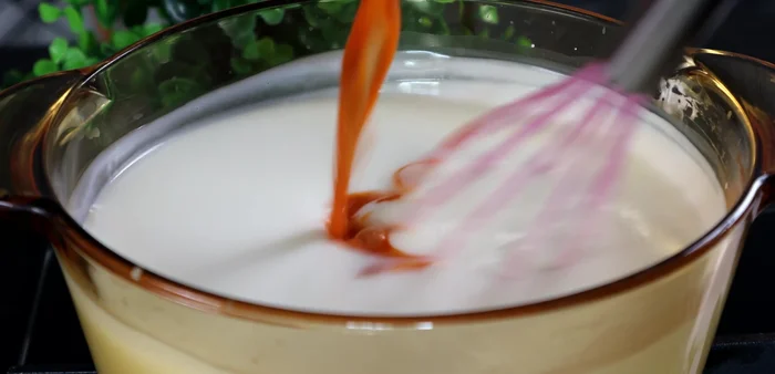 Once the milk is slightly thickened, add the tea mixture.