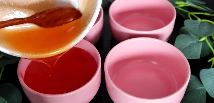 Pour the jelly mixture into bowls and let it cool to solidify.