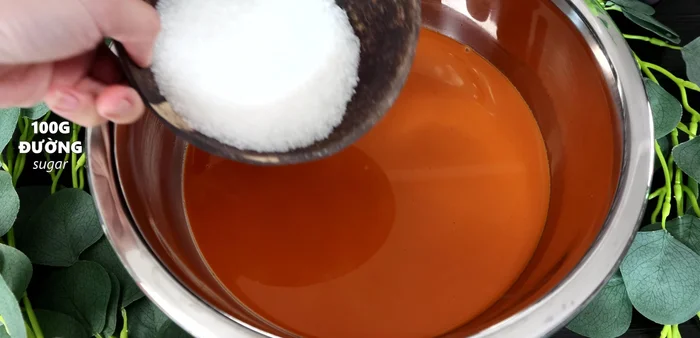 Add sugar to the tea mixture and stir.