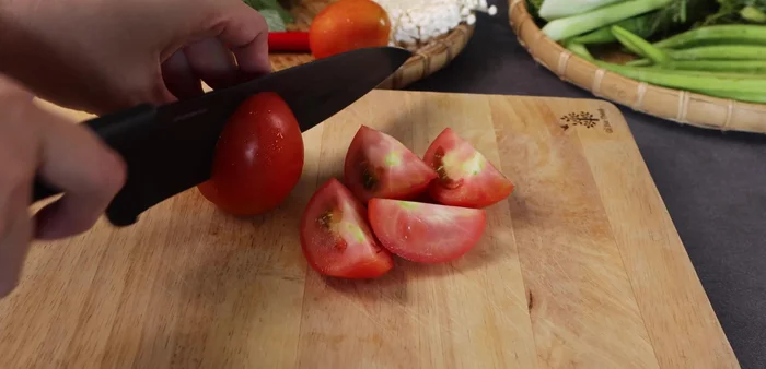 Prepare the vegetables: Cut tomatoes into quarters (remove core), chop herbs (coriander, basil), cut okra diagonally, slice mint thinly, cut water spinach into 6cm pieces, and prepare enoki mushrooms.