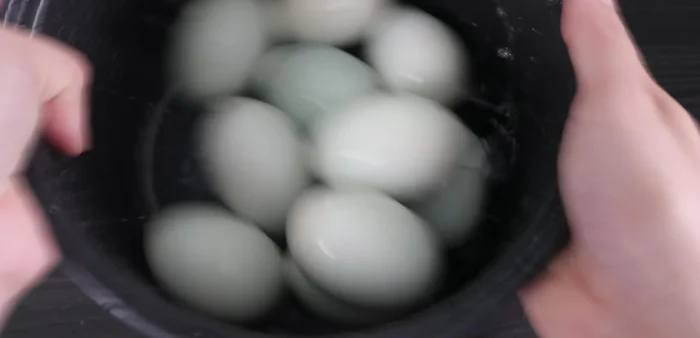 Peel the boiled eggs.