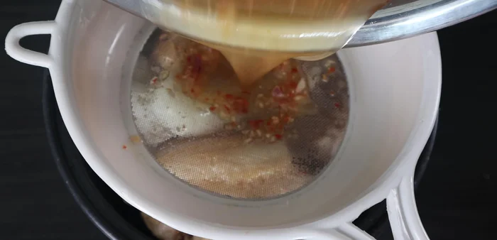 Filter the marinade through a mesh bag containing the onions and garlic to avoid cloudiness in the broth.