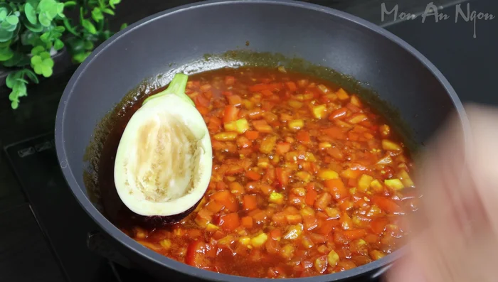 Arrange the eggplant halves in the pan with the tomato mixture. (283.639)