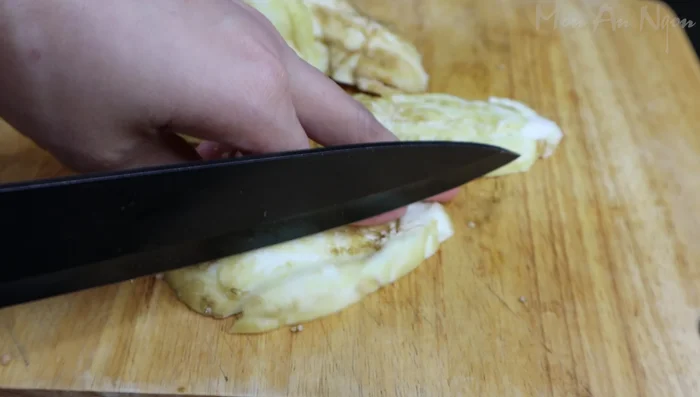 Finely chop the scooped-out eggplant flesh. (94.96)