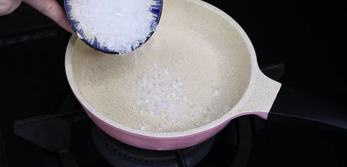 In a small pan, melt rock sugar until golden brown. Add the remaining pork fat and the chopped aromatics (onions, garlic, and chili).