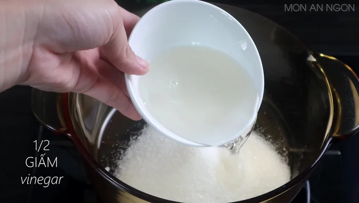 Prepare the vinegar and sugar water: Boil sugar, vinegar, water, and salt. Let cool.