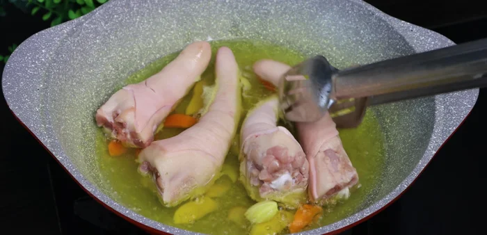 Add pig's tails and boil for 5 minutes, turning occasionally.