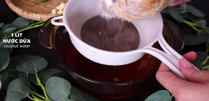 Add 1 liter of fresh coconut water (boiled and strained) to the pot.