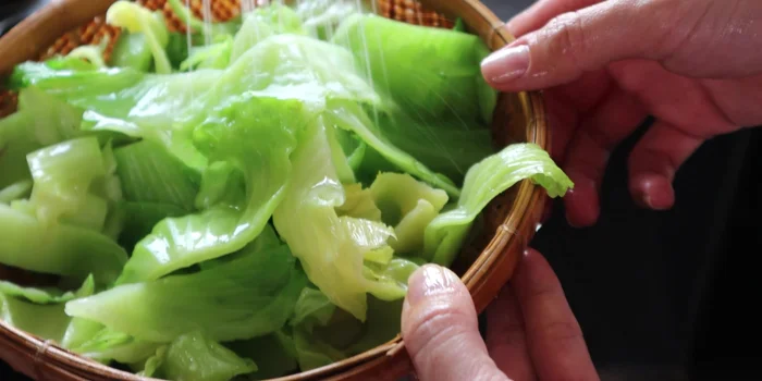 Rinse the blanched cabbage with cold water to maintain crispness.
