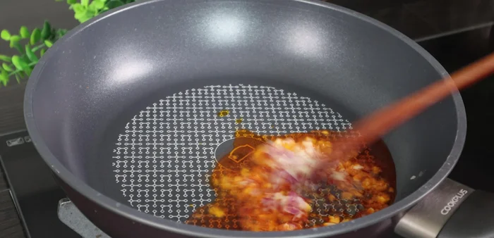 Add minced garlic and shallots and fry until golden and fragrant.