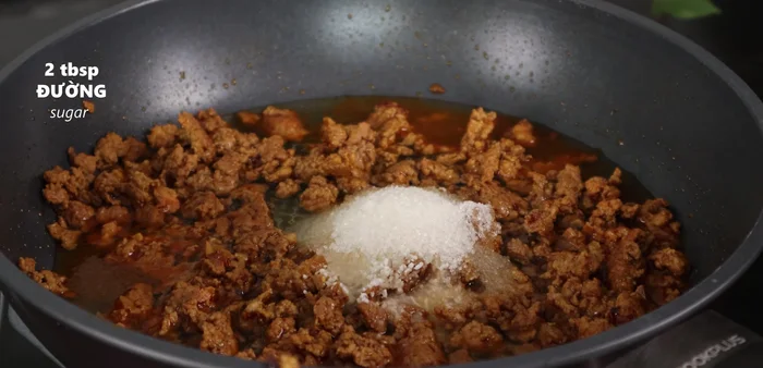 Add 2 tablespoons seasoning powder, 2 tablespoons sugar, 2 tablespoons fish sauce, 1/4 tablespoon salt, 1 tablespoon MSG, and peanut butter. Stir well until spices dissolve.