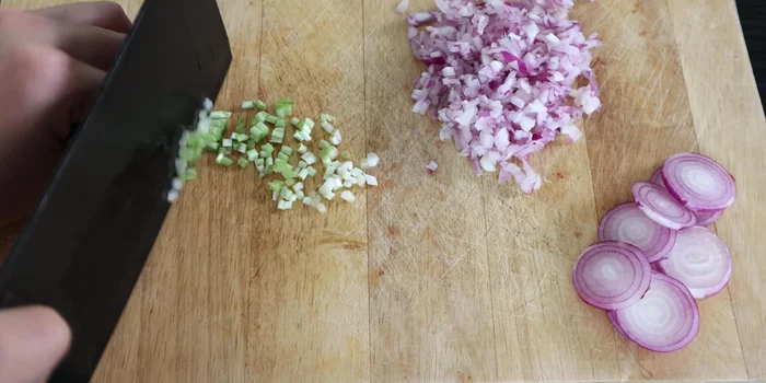 Finely chop green onions; reserve some for garnish.