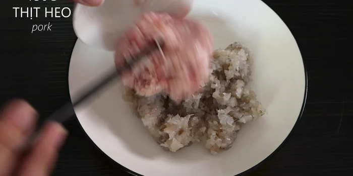 Combine minced pork, fish sauce, and duck eggs (reserve 2 yolks).