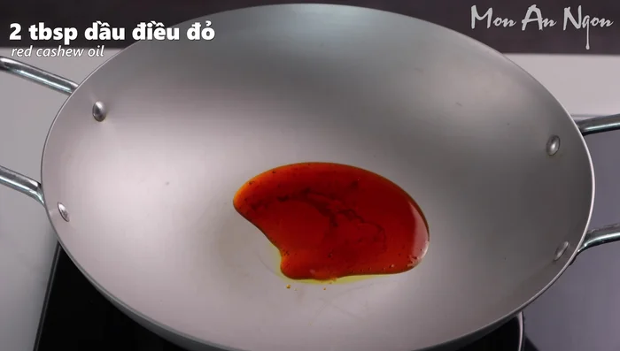 Heat annatto oil in a pan. Add shallots and chili, cook until slightly golden brown and fragrant.