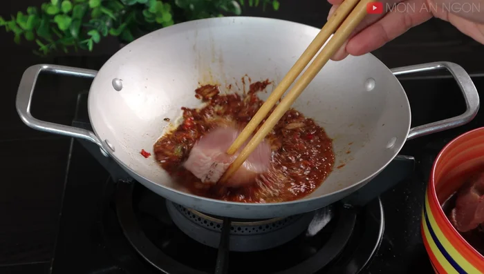 Add the marinated fish to the pan, and cook until both sides are firm.