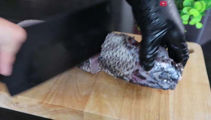 Score the fish into bite-sized pieces, leaving the head and tail for another dish.