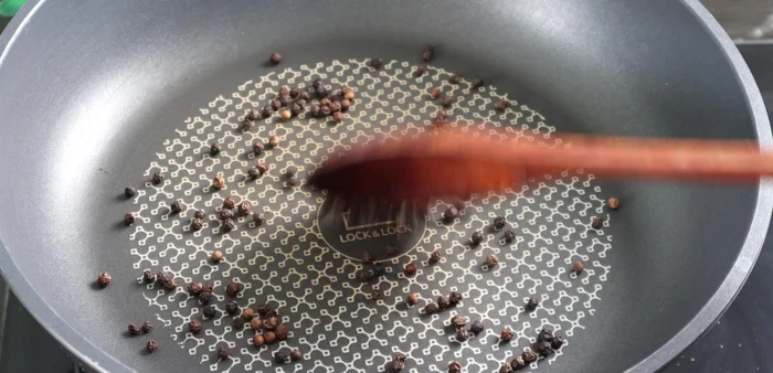 Roast the peppercorns until fragrant.