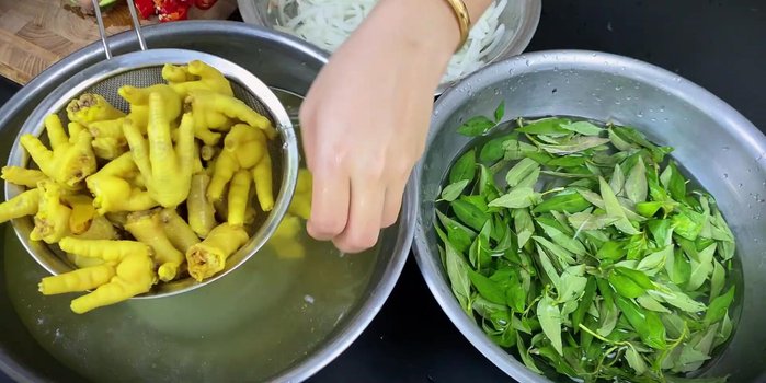 Drain chicken feet.