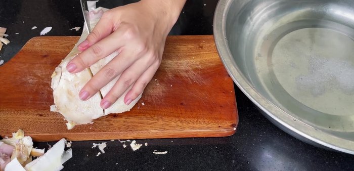 Cut the bamboo shoots in half, then slice thinly. Peel the shoots using a peeler for faster results.