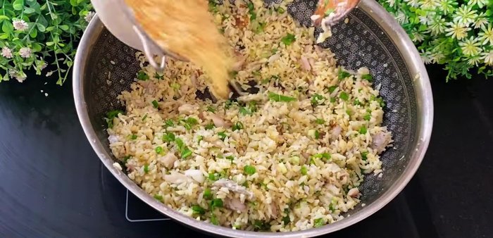Add crispy rice: Add the crispy fried rice and stir gently. Garnish with green onions and cilantro.