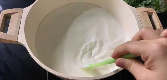 Heat the milk mixture until warm (40-45°C) (604.68).