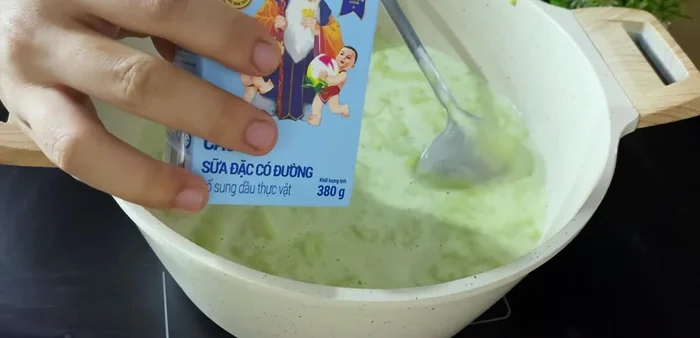 Pour the mixture into a pot. Add condensed milk and stir well.