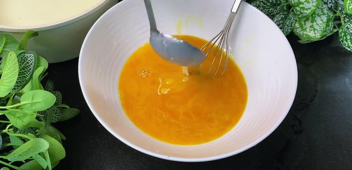 Combine the egg and milk mixture: Gradually pour the warm milk mixture into the egg mixture, whisking constantly to prevent cooking the eggs.