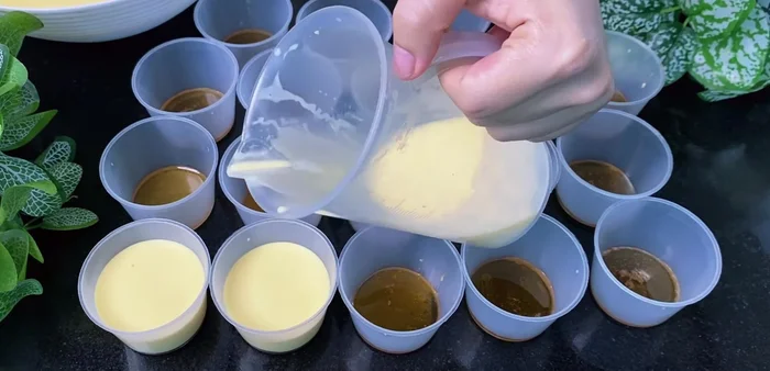 Pour the batter into molds: Pour the batter into the caramel-lined molds, leaving some space at the top.