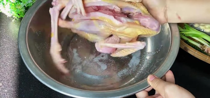 Marinate the chicken with salt, white wine, seasoning, sugar, and pepper. Rub the marinade evenly inside and out. Let it sit for 12-15 minutes.