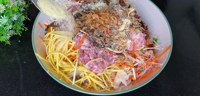 Add fried onions, seasoning, sugar, and pepper to the filling. Mix well, ensuring the filling is dry and not watery.