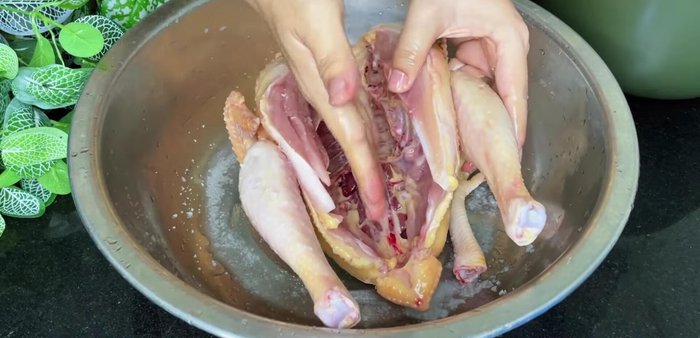 Cut the chicken in half.