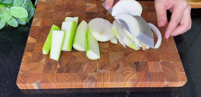Prepare the onions and green onions by slicing them.