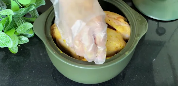 Add the marinated chicken to the pot, then add the remaining squash and green onions on top.