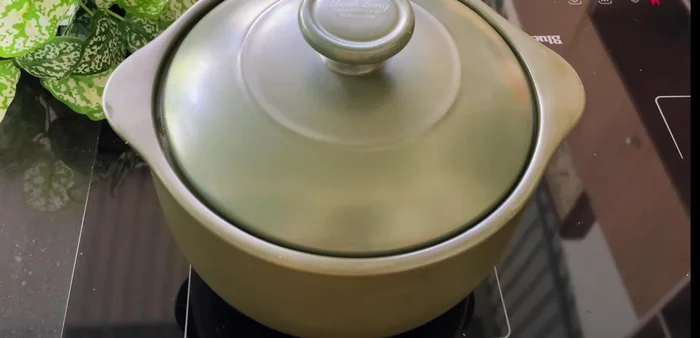 Cover the pot and place it on the stove over low heat until hot. Then, increase heat to high until steam is visible, then reduce heat to low.