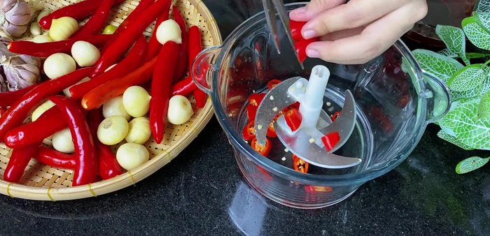 Prepare the garlic and chili: Finely chop the garlic and chili peppers. Blend them until smooth.