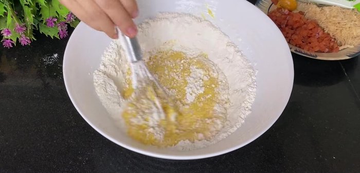 Add wet ingredients: Add fresh milk and cooking oil to the yolk mixture. Stir until the flour is no longer sticky and the mixture is smooth. Avoid overmixing.