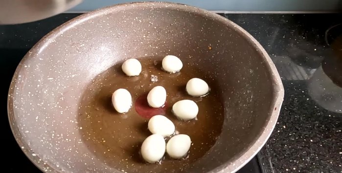 Lightly fry the quail eggs until slightly golden.