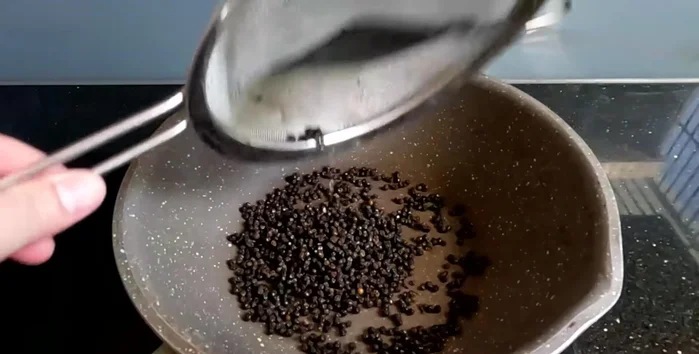 Roast the peppercorns in a pan until they are shiny, round, and fragrant, making a squeaking sound. (79.36)
