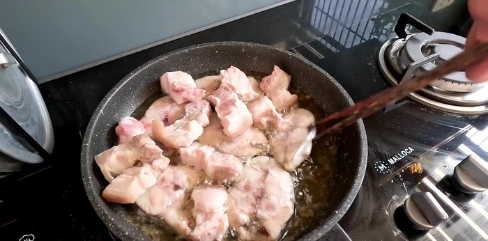 Fry the pork belly until lightly browned.