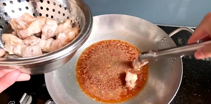Add the pork belly to the pot, placing it at the bottom. Add the fried mackerel on top.