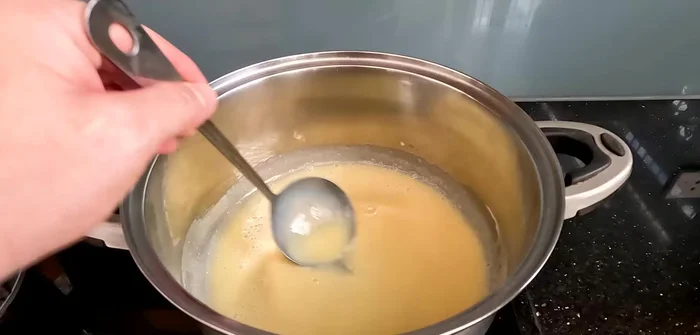 Add 2 liters of fresh milk. Cook for 2-3 minutes to warm the milk (101.56). Check temperature; if too hot, let it cool for 4-5 minutes (143.879).
