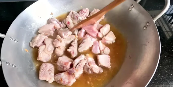 Add the grated coconut meat during the last 10-15 minutes of cooking. Simmer until the sauce thickens slightly.