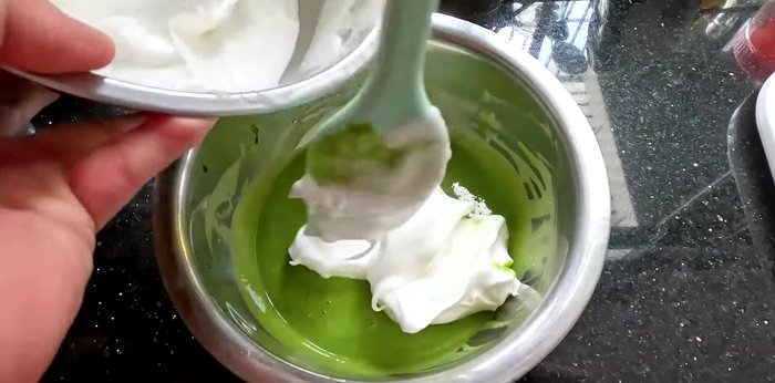 Gently fold 1/4 of the beaten egg whites into the yolk mixture. Then, fold the yolk mixture into the remaining egg whites, mixing gently in one direction. (154.519)